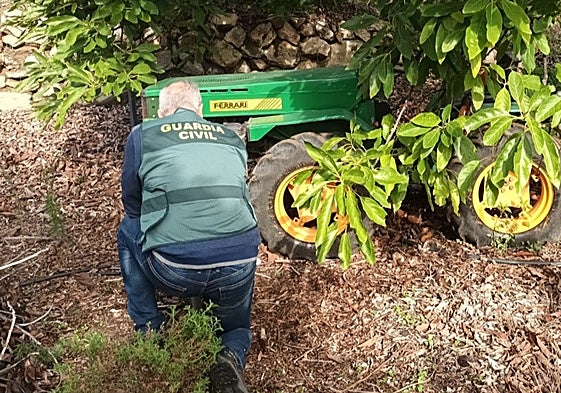 A police officer from the Guardia Civil's Seprona branch inspects the tractor.