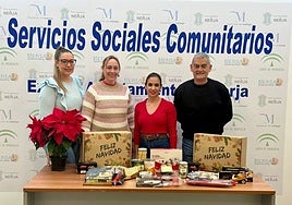 Town hall representatives with some of the products included in the hampers.