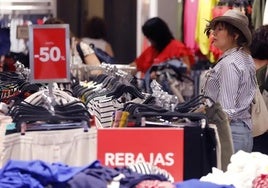 File image of a shopper at sale time.