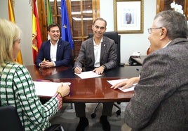 Mayor Juan Antonio Lara signs the contract.