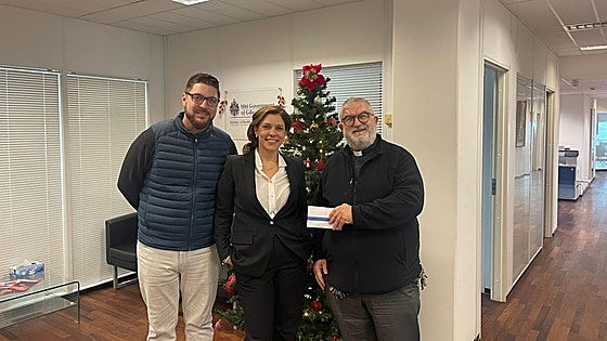 Donation helps provide Christmas hampers for needy on the Rock
