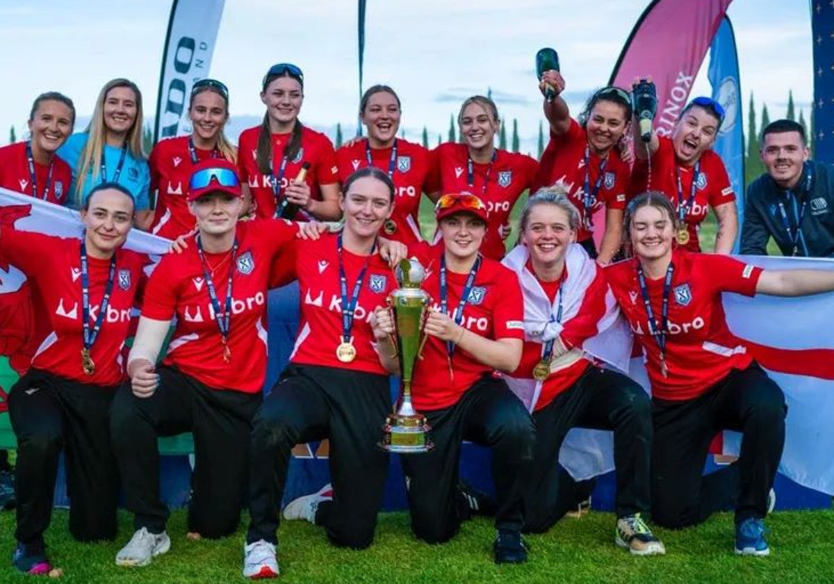 The England XI players pose with the trophy.