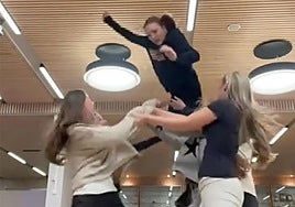 Young girls attempt the 'Superman Challenge'.