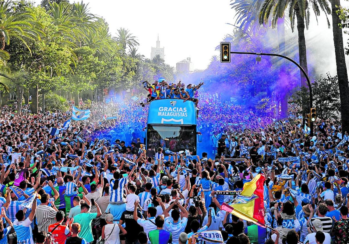 Thousands of people turned out to welcome the Malaga CF players home.