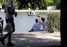 People in the shade on a summer's day.