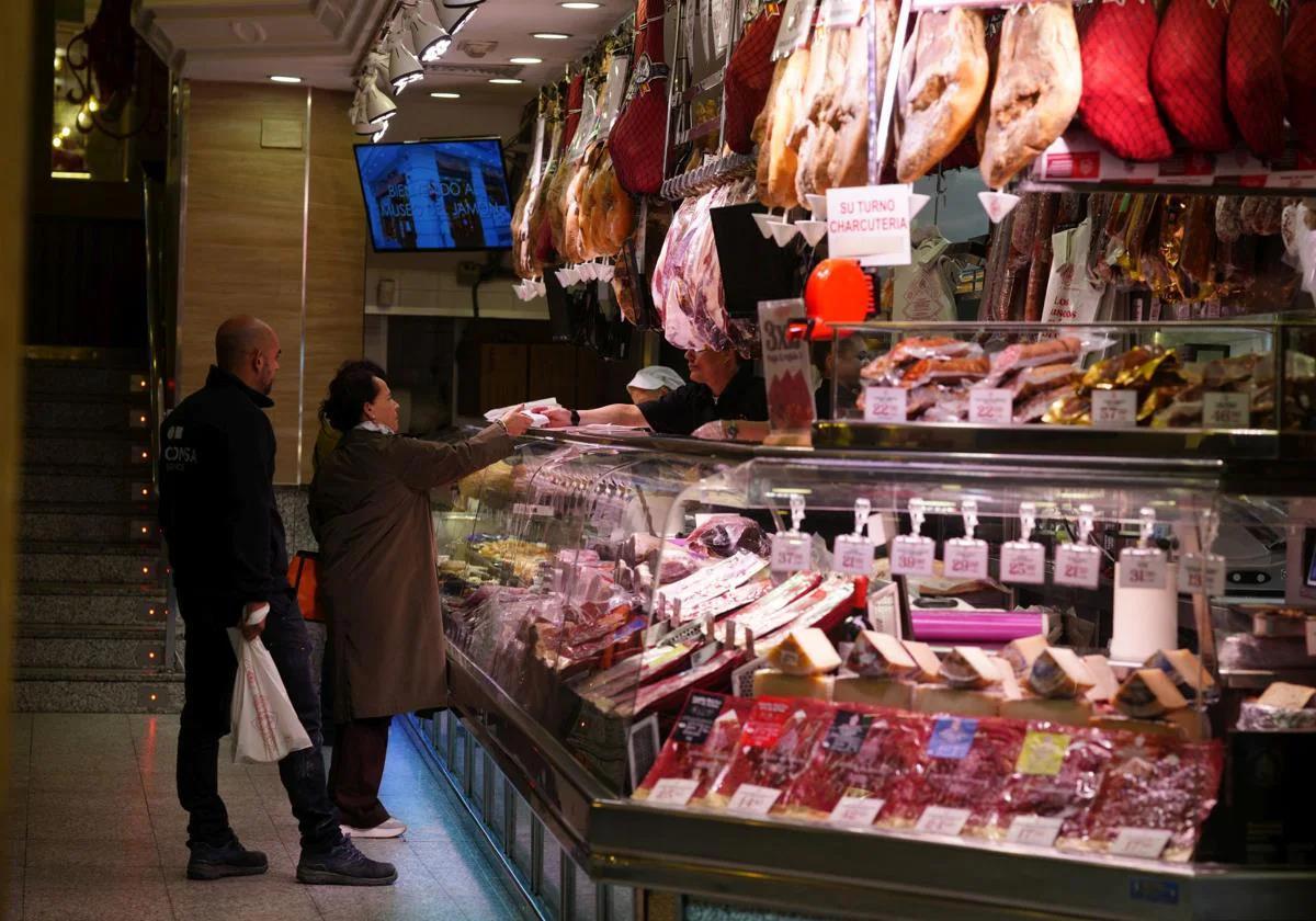 Shoppers at a food market in Madrid.