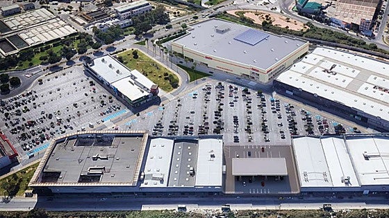 Why has the start on the Costco superstore in Malaga been delayed?