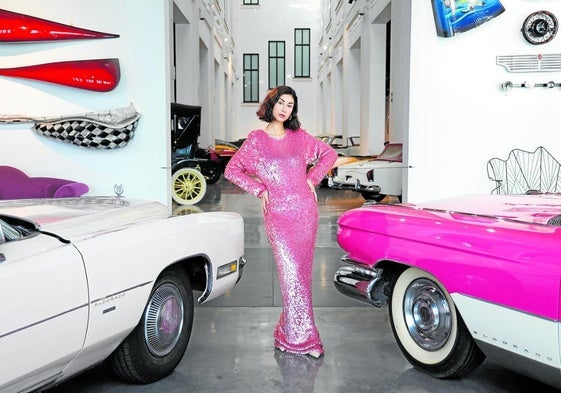 Kika Magalhães poses in a dress by Enrico Coveri from the Automobile and Fashion museum in Malaga.