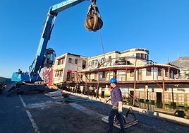 Heavy machinery at work as the Willow paddle steamer is broken up before heading to the scrapyard.