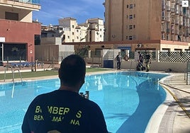 Municipal workers empty one of the swimming pools.