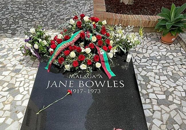 Her Black granite tombstone.