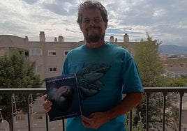 Paco Pinto with his encyclopaedia of sharks.