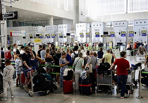 File image of queues at the check-in desks at Malaga Airport.