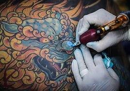 Tattooist at work.