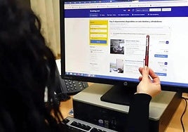 Young woman browsing the official Booking.com website.