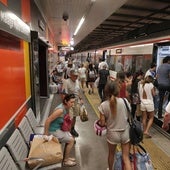 Passengers board one of the Cercanías trains on the coast.