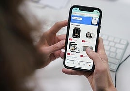 A woman makes an online purchase.