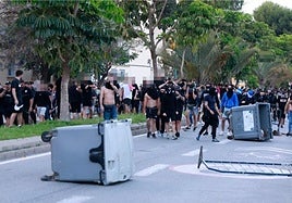 Containers knocked over in Avenida de La Palmilla after the riots following the Malaga-Ibiza match on 27 May 2023.