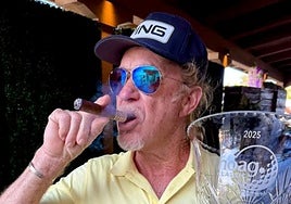 Jiménez celebrates with his signature cigar.