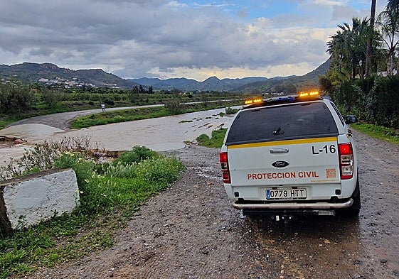 Members of the civil protection team watch over Campanillas during storm Laurence.