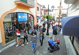 When will the major shops and retail parks in Malaga and along the Costa del Sol be open this Easter?