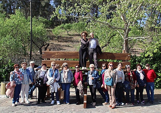 Residents of Cuevas de San Marcos on the giant bench in the town.