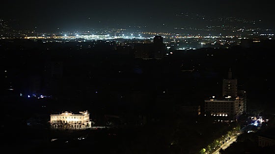 Why did some areas of Malaga get their power back earlier than others?