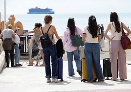 Tourists looking out over Malaga's bay this Easter.