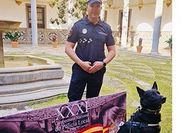 Local Police officer David Bravo with his dog, Loki.