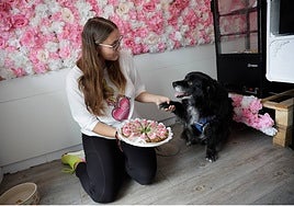 Owner Simona with her rescue dog Maco inside her newly-opened business venture.