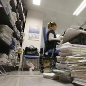 Case folders and files pile up in one of Malaga's courts.