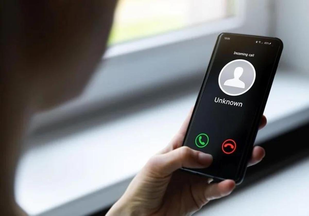 A person receives a spam call.