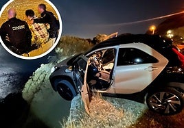 The car ended up perched right on the cliff edge. (Inset) police officers attend to the driver.