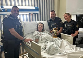 The officers with the mother and the baby, who was given a Paw Patrol cuddly toy.