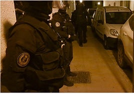 GRS officers guard one of the search sites from Wednesday's raids in the Sierra de Cadiz.