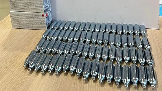 Young man caught with 120 canisters of 'laughing gas' after he tried to flee police checkpoint in Mijas