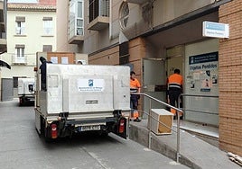 Photo captures the process of moving the office's furniture.