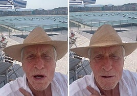 Michael Douglas with La Concha beach in San Sebastian in the background.