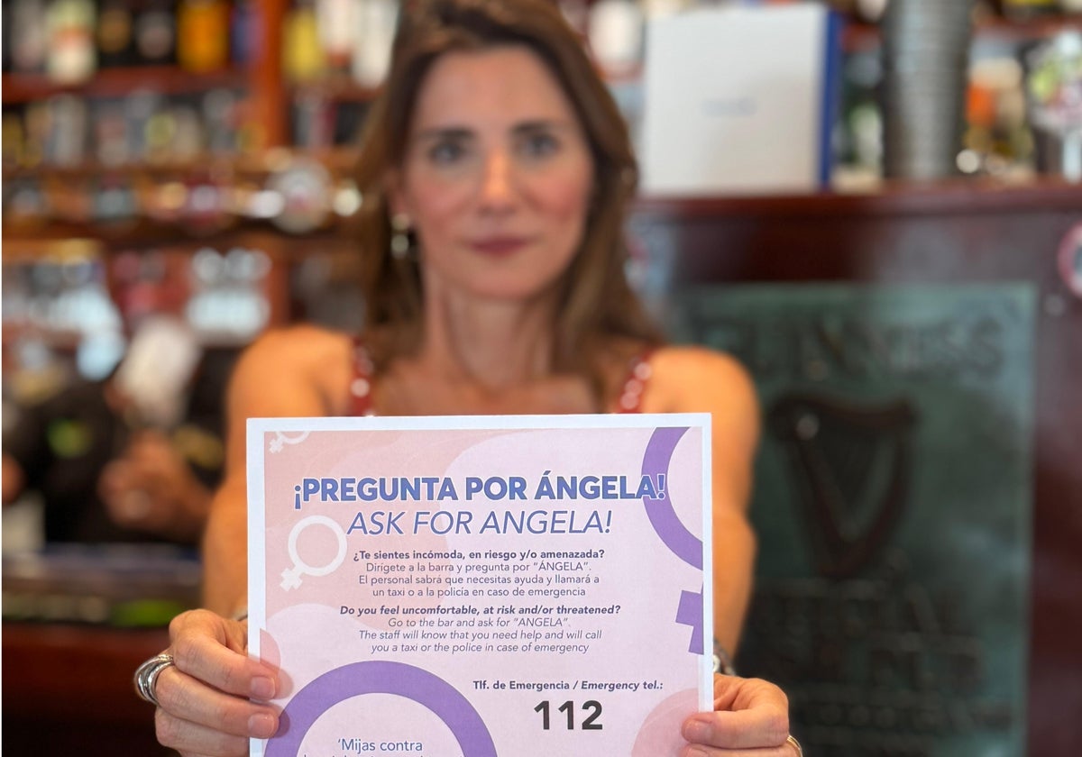 Mayor Ana Mata with one of the campaign posters.