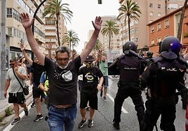 Strikers pass police.