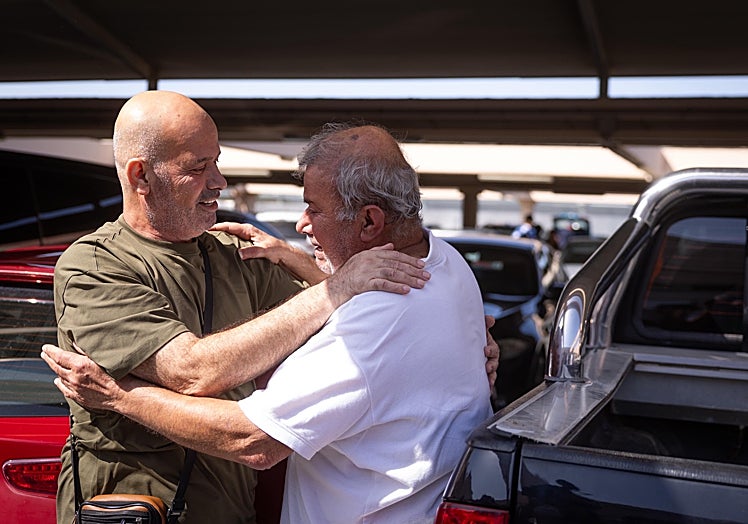The moment of the emotional reunion of Kayed, on the left of the picture, and Sadi.