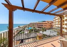 View of the pool and garden area of a beachfront hotel on the Costa del Sol.
