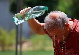 A man cools off in the street in Cordoba, in the 43C reported last Tuesday.