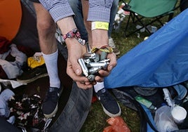 Nitrous oxide or laughing gas canisters discarded at a music festival.