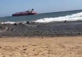 Bathers being swept by the current at Playa del Vigía.