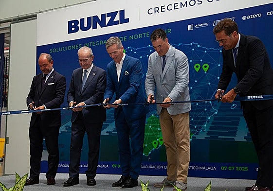 Authorities and Bunzl heads cut the ribbon at the logistics centre on Monday.