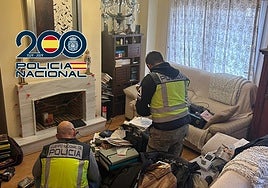 Police search one of the suspects' home.