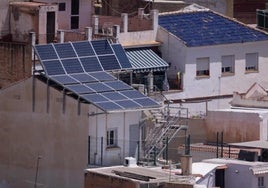 Installation of solar panels on a building in the city of Malaga.