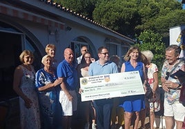 The Lions present Afesol with the donation.