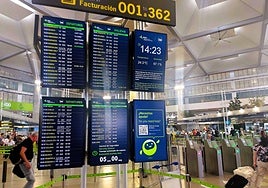 Departure boards at Malaga Airport.